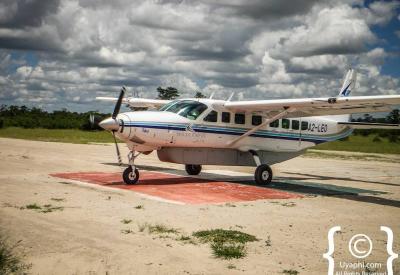 Bush airstrip landing approach light aircraft Botswana fly-in safari photography