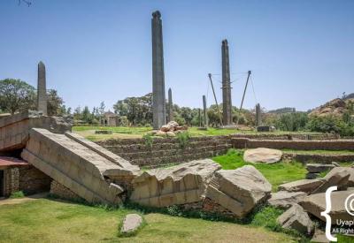 Axum Stelae Ethiopia dramatic light shadow carved monolith surface photography Uyaphi