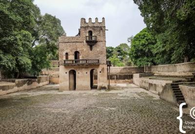 Fasilides Bath Gondar Ethiopia three-storey palace solid columns above waterline photography