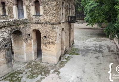 Fasilides Bath Gondar Ethiopia three-storey palace solid columns above waterline photography