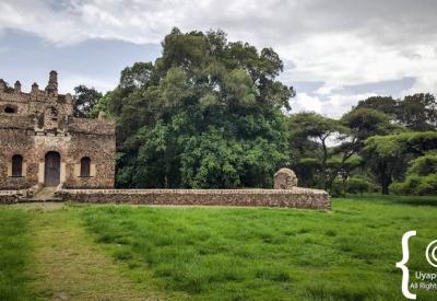 Fasilides Bath Gondar Ethiopia exterior stone wall towered gates compound photography