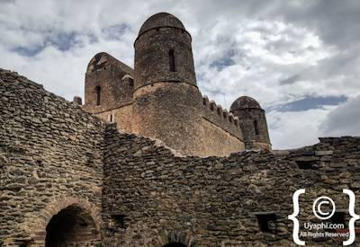 Fasil Ghebbi Gondar Ethiopia atmospheric ruins highland greenery backdrop photography Uyaphi