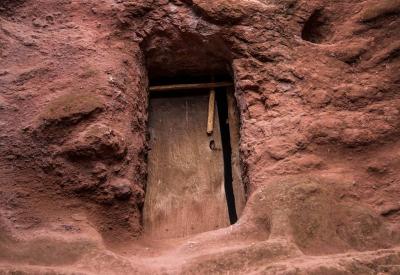 Lalibela Northern Cluster pathway to hell 32-metre dark tunnel carved rock no lighting Ethiopia