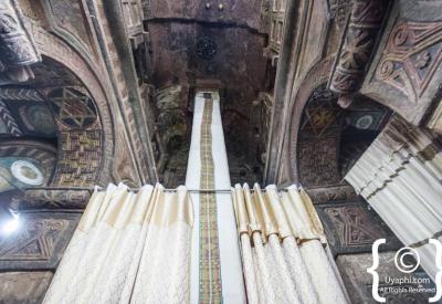 Lalibela Southern Cluster Ethiopian Orthodox priest interior church sacred site photography