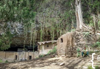 Yemrehanna Kristos Ethiopia cave church exterior dramatic cliff face 90 minutes Lalibela