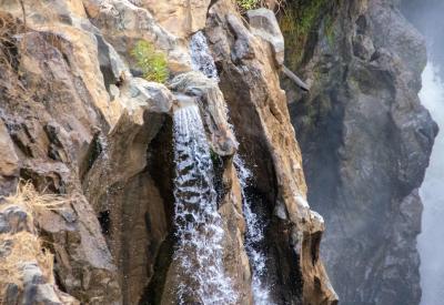 Epupa Falls lush vegetation arid Kaokoveld landscape Kunene River Namibia