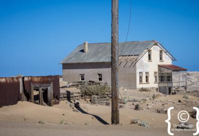 Kolmanskop colourful interior half-buried sand Namib Desert ghost town Namibia