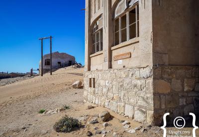 Kolmanskop colourful interior half-buried sand Namib Desert ghost town Namibia