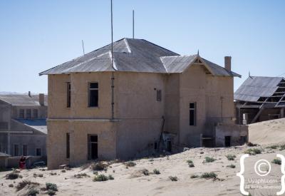 Kolmanskop Namib Desert sand dunes encroaching abandoned buildings Luderitz Namibia