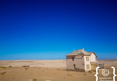 Kolmanskop German colonial buildings blue sky Namib Desert ghost town Luderitz Namibia
