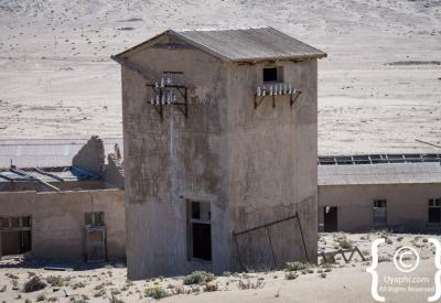 Kolmanskop doorway buried in sand Namib Desert ghost town photography Luderitz Namibia