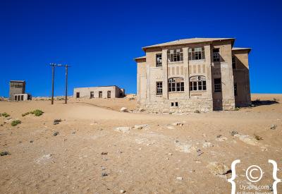 Kolmanskop Namib Desert sand drifting through doorways ghost town Namibia
