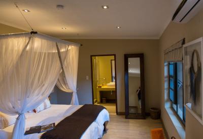 Onguma Bush Camp central guest area waterhole views fish terrapins Etosha Namibia