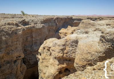 Sesriem Canyon walking path descent 30 metres deep Namib Desert Namibia photography