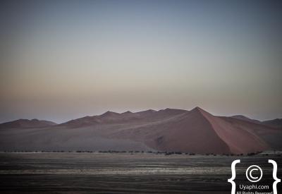 Dune climb silhouette ridge Sossusvlei Namib Desert Namibia photography