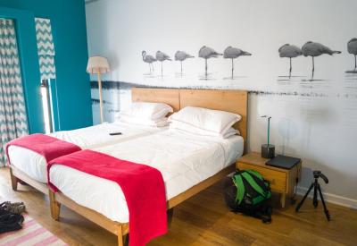 The Delight Swakopmund large colourful guest room comfortable beds Swakopmund Namibia
