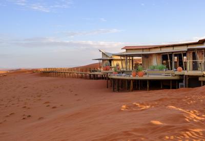 Wolwedans Dunes Lodge NamibRand Nature Reserve Namib Desert sunset remote Namibia