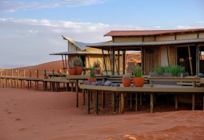 Wolwedans Dunes Lodge NamibRand Nature Reserve Namib Desert sunset remote Namibia