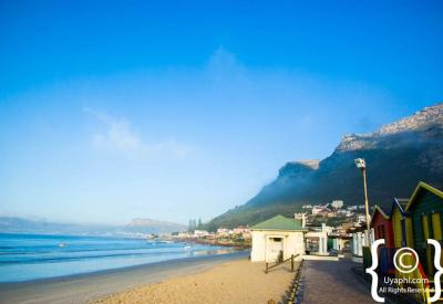Surfers at Muizenberg beach False Bay Cape Town beginner surf spot South Africa