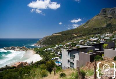 Camps Bay Blue Flag beach palm trees Twelve Apostles mountain backdrop Cape Town
