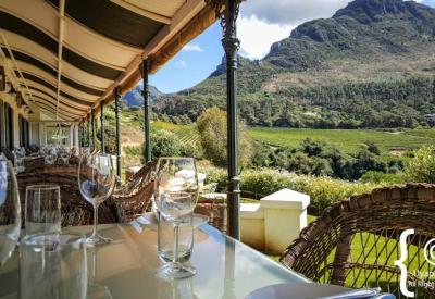 Constantia Glen outdoor wine tasting area overlooking Cape Flats and Stellenbosch mountains