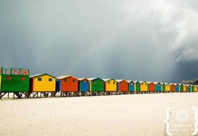 Families swimming Muizenberg beach warm False Bay waters Cape Town South Africa