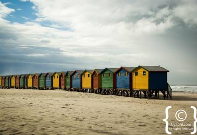 Families swimming Muizenberg beach warm False Bay waters Cape Town South Africa