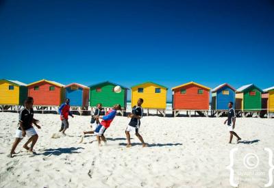 Surfers at Muizenberg beach beginner surf spot False Bay Cape Town South Africa