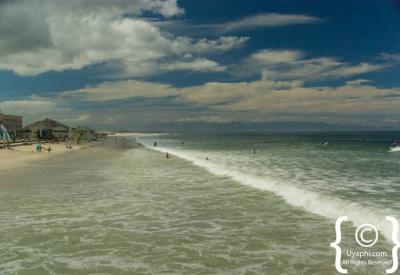 Surfers at Muizenberg beach beginner surf spot False Bay Cape Town South Africa