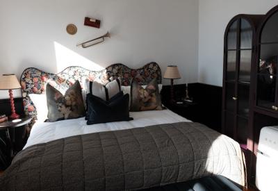 Tintswalo Summer House eclectic decor lounge with fresh flowers Glencairn Cape Town