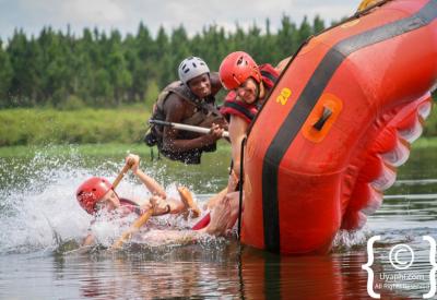 Rafting team navigating grade 4 rapid Nile River Jinja Uganda