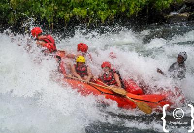 White water raft flipping grade 5 Nile River Uganda adventure safari