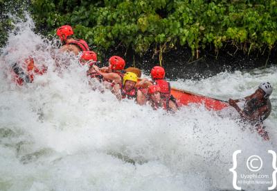 Raft crew paddling Nile River Jinja Uganda white water rafting