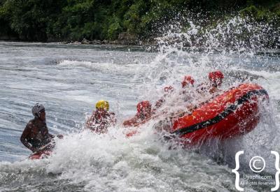 White water rafting team high five Nile River Uganda Jinja