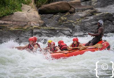 Raft crew paddling Nile River Jinja Uganda white water rafting