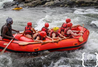 White water rafting team cheering Nile River Jinja Uganda