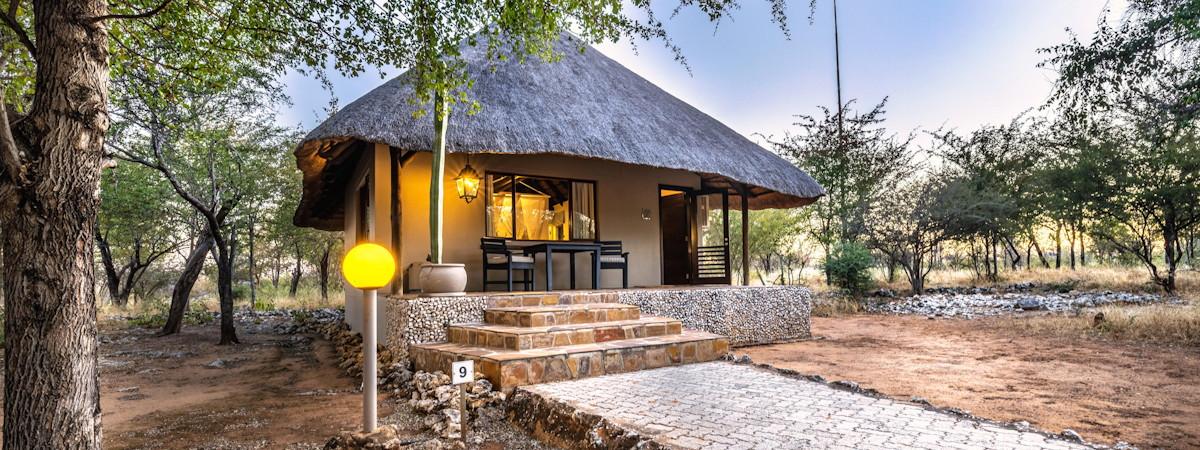Beautiful thatched Mushara Lodge bordering the Etosha National Park