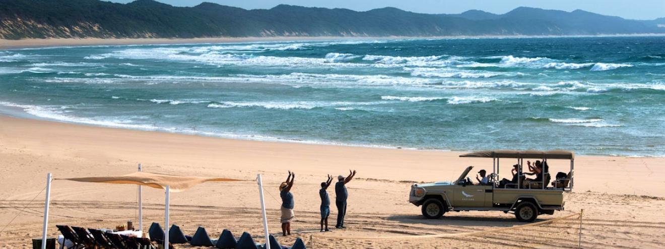 Zululand beach with golden sands, turquoise waves, and lush greenery, perfectly highlighting the coastal beauty featured on the KwaZulu Natal Map