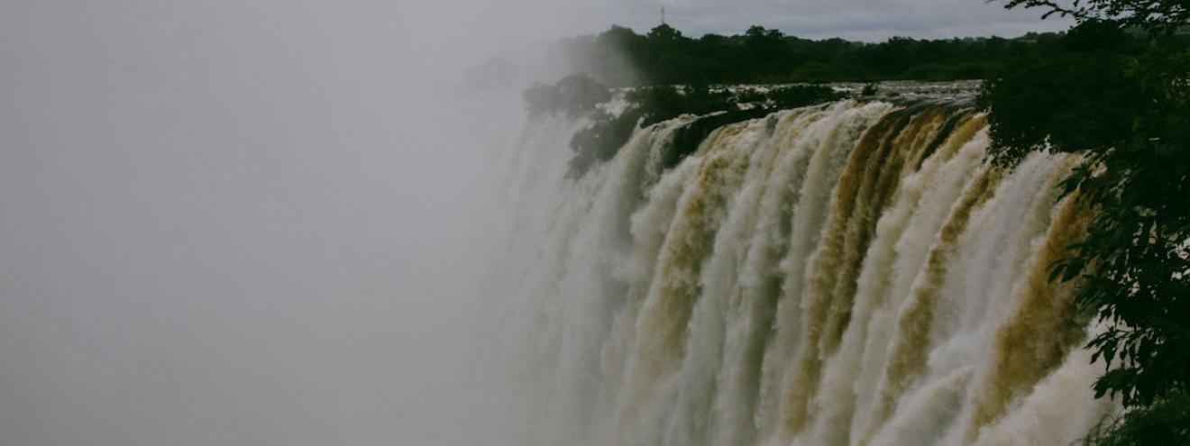 Top 10 must-see attractions Victoria Falls Zimbabwe rainforest viewpoints Devil's Pool helicopter rafting
