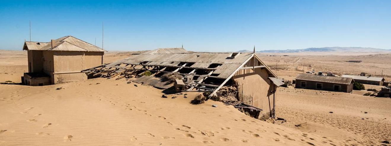 Kolmanskop ghost town diamond mining Namibia Luderitz desert reclaiming buildings