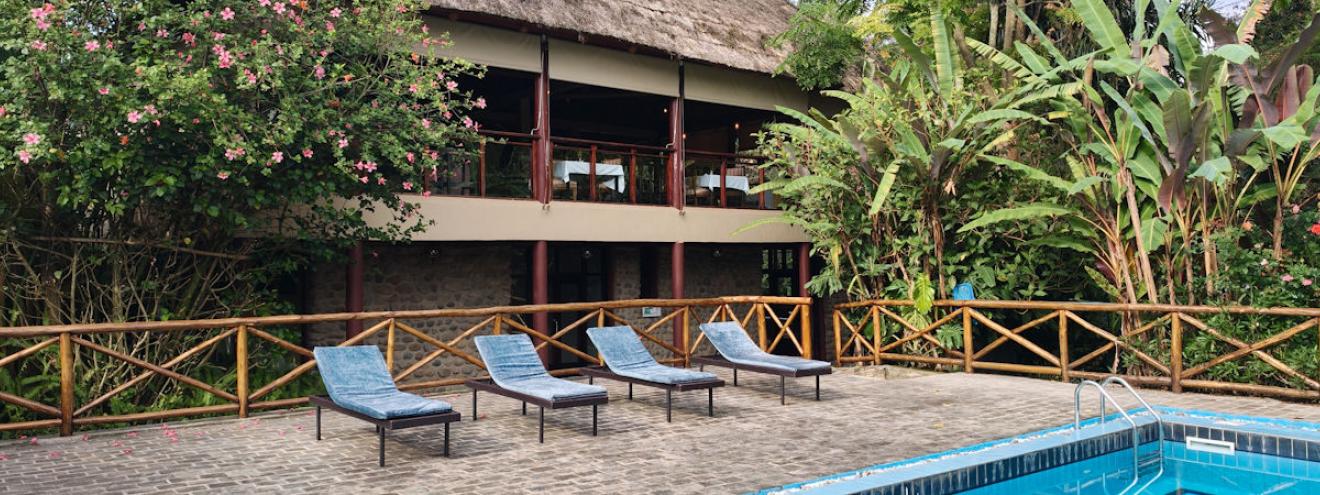 Tiloreza Volcanoes Ecolodge gardens and suites below the Virunga mountains Volcanoes National Park Rwanda