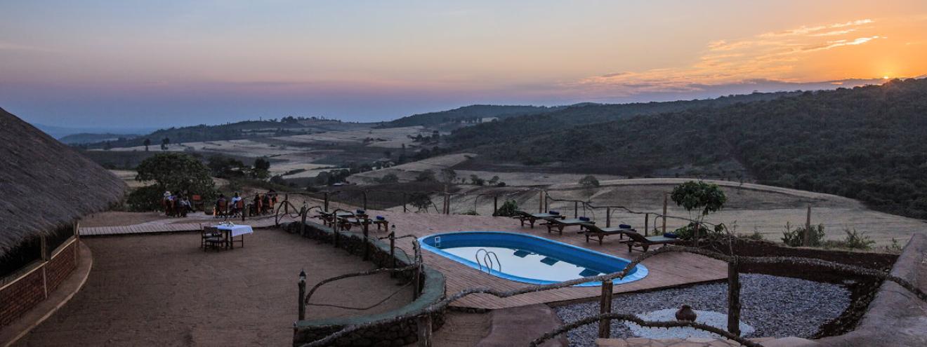 Karatu Simba Lodge 23 thatched cottages Ngorongoro Forest rural farm Tanzania budget