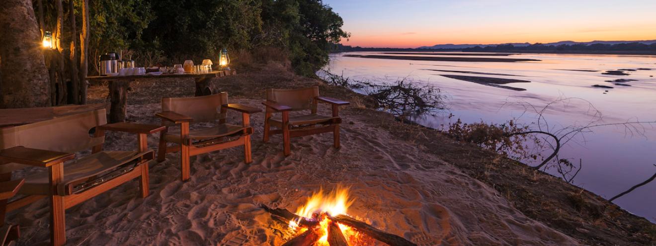 Bilimungwe Bushcamp luxury thatched chalets nestled under a canopy of ancient mahogany trees