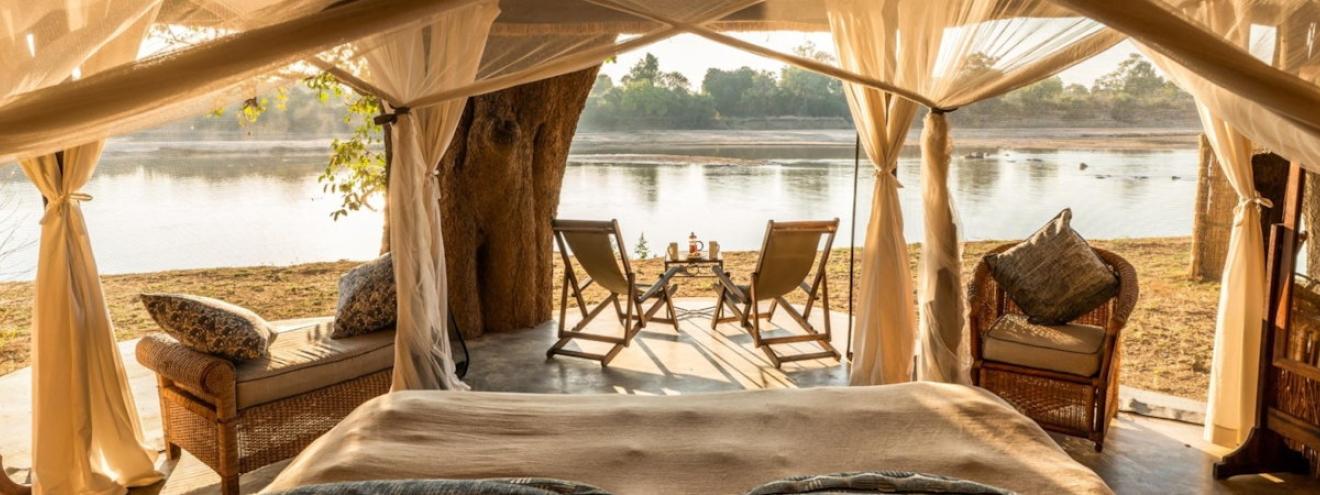 Mchenja Camp luxury canvas and thatch tents nestled in a spectacular ancient ebony grove on the Luangwa River