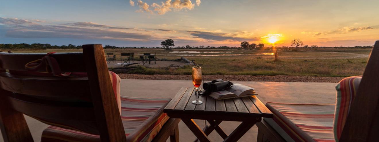 Camp Hwange 8 thatched chalets Sinamatella private concession waterhole Hwange Zimbabwe
