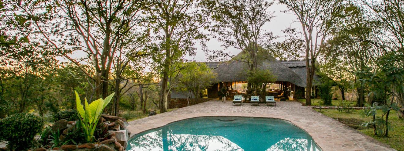 Masuwe Lodge 12 thatched chalets hilltop waterhole Masuwe River Victoria Falls Zimbabwe