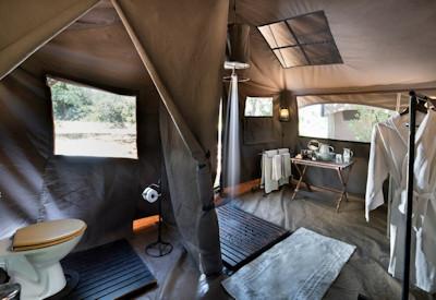 En-suite bathroom with bucket shower and toilet