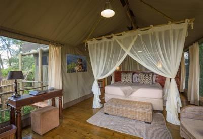 Tented bedrooms at this Okavango water camp
