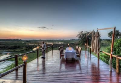 Kanana dining deck at sunset with figs ebony and knobthorn trees