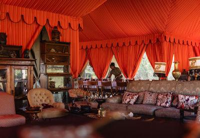 Luxury lounge area with well stocked drinks cabinet